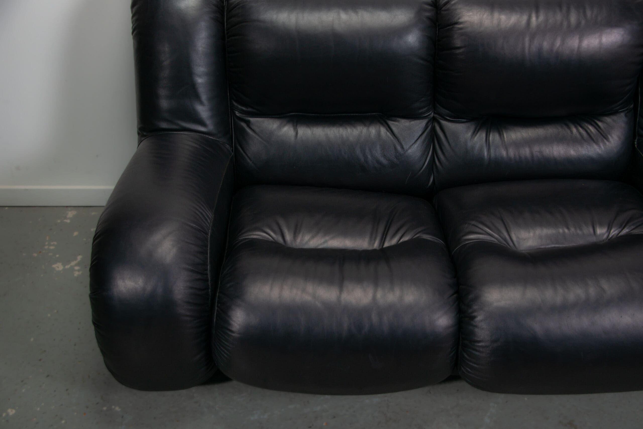 Black leather space age Italian 2 seater sofa