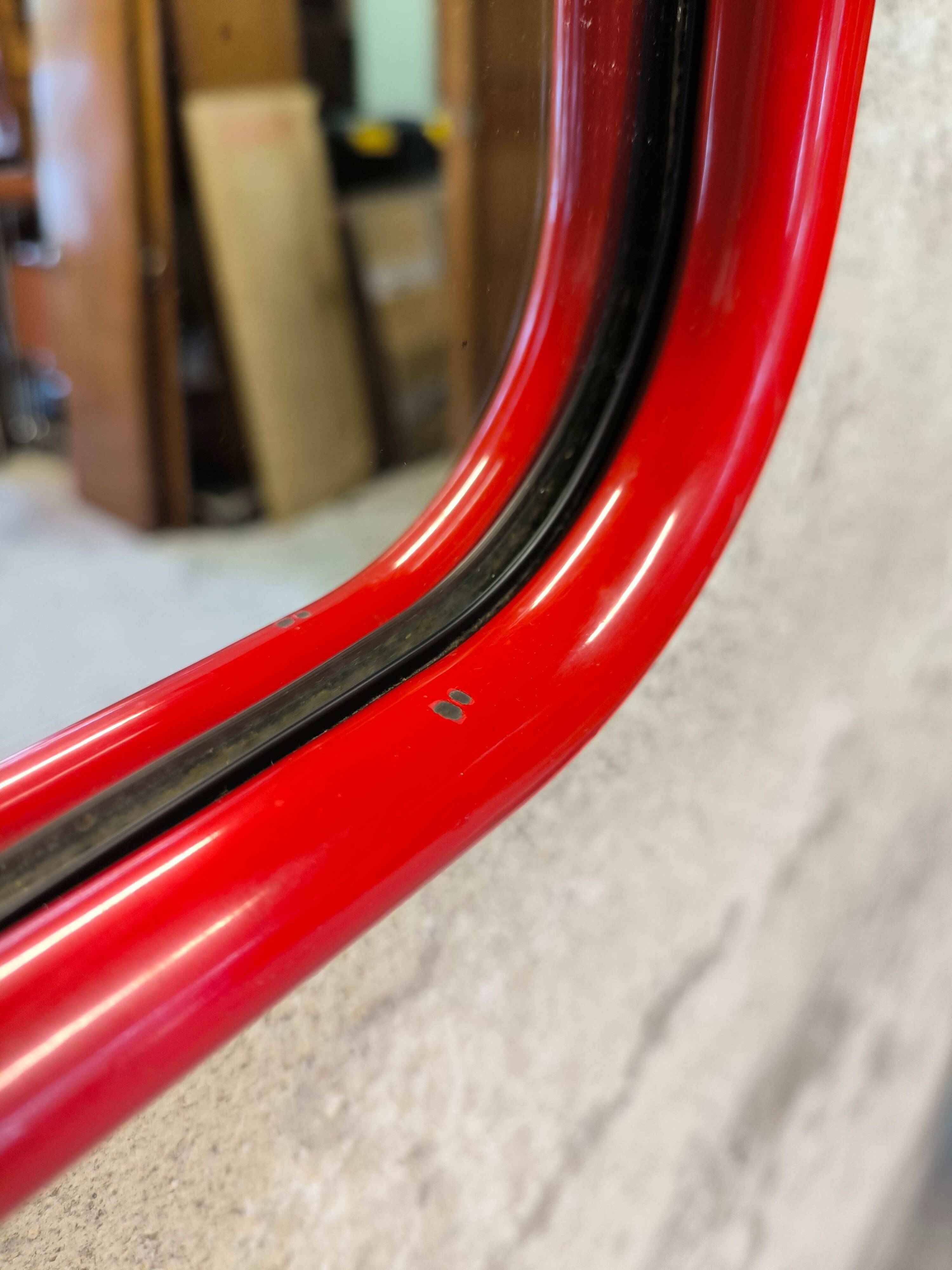 Vintage post-modern lacquered red metal mirror