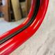 Vintage post-modern lacquered red metal mirror