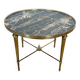 Round coffee table in brass with a marble top from the Ramsay house.