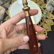 Wood and brass serving utensils