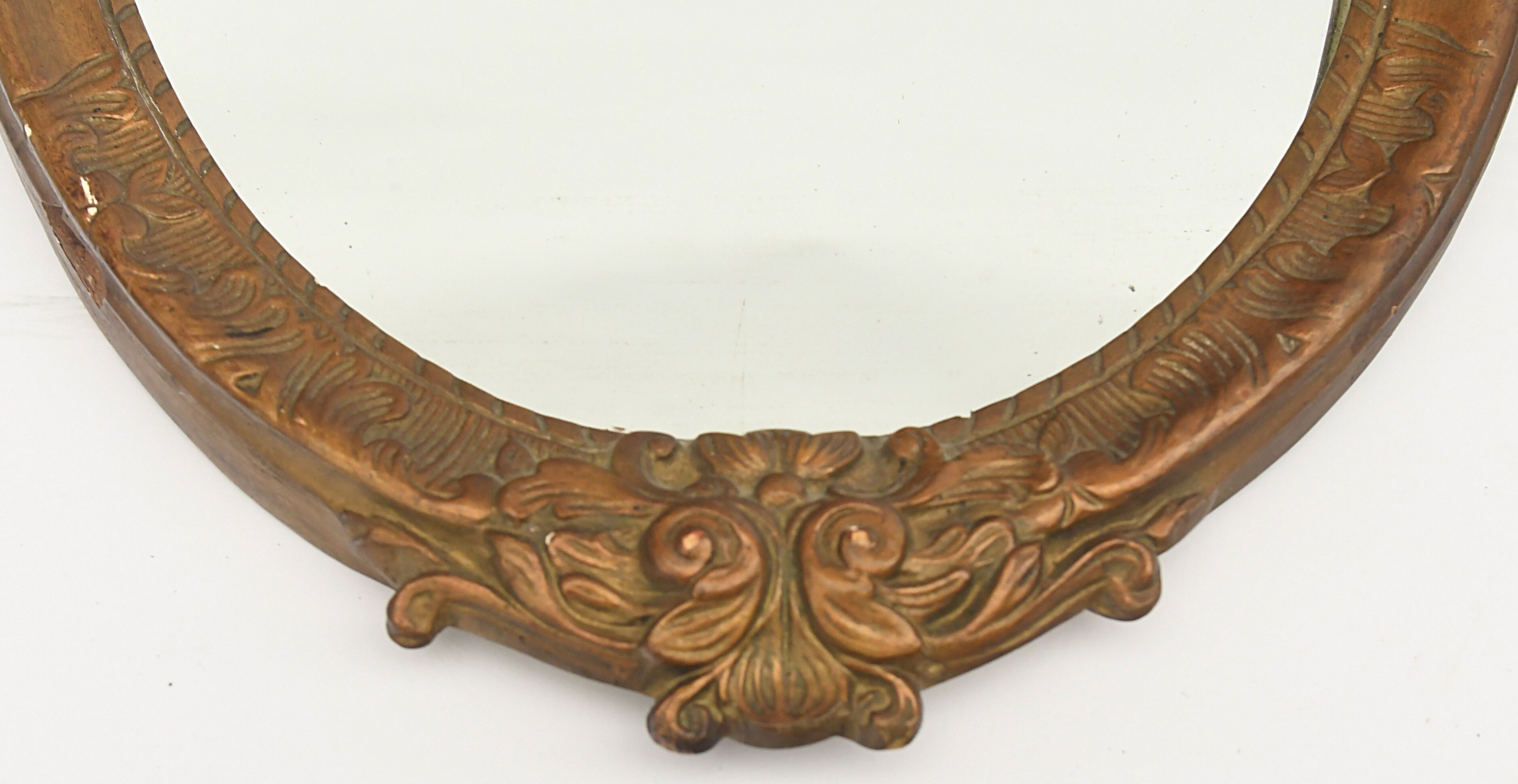 Pair of oval wooden windows with golden patina