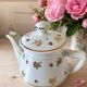 Porcelain teapot Louis Lourioux, decorated with roses and pyroluxe gilding.