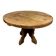 Round table in solid wood, thick top, vintage brutalist style from the 1960s.