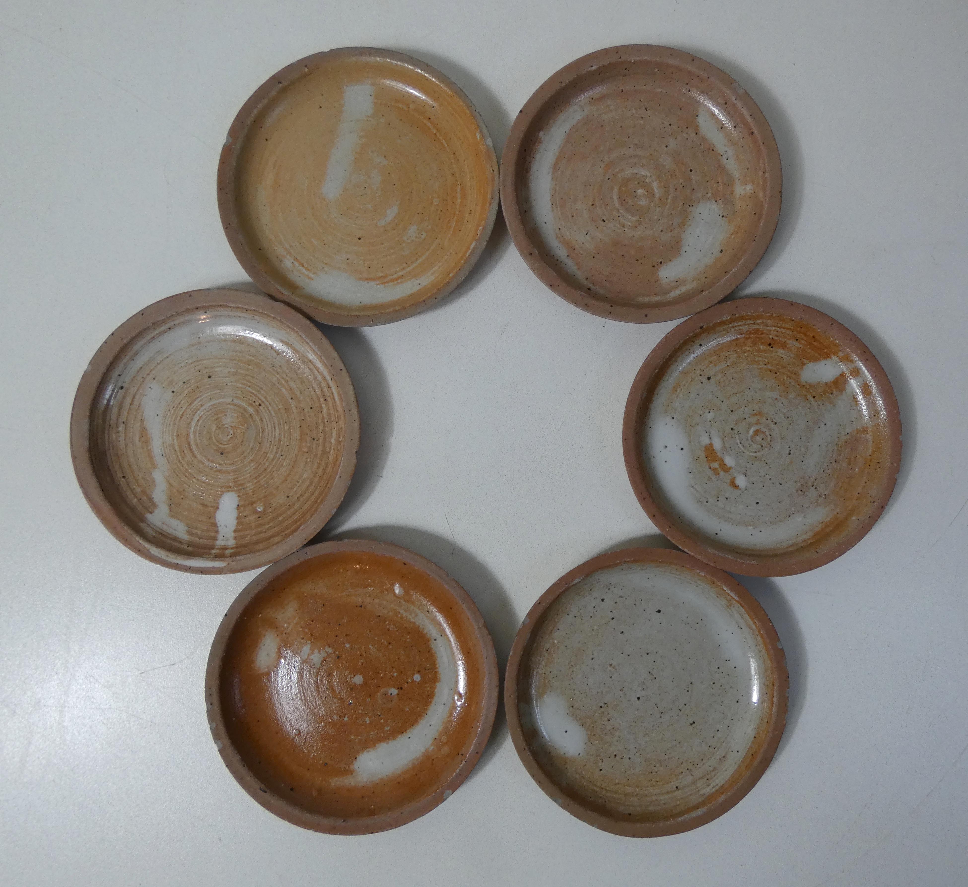 6 stoneware cups and saucers