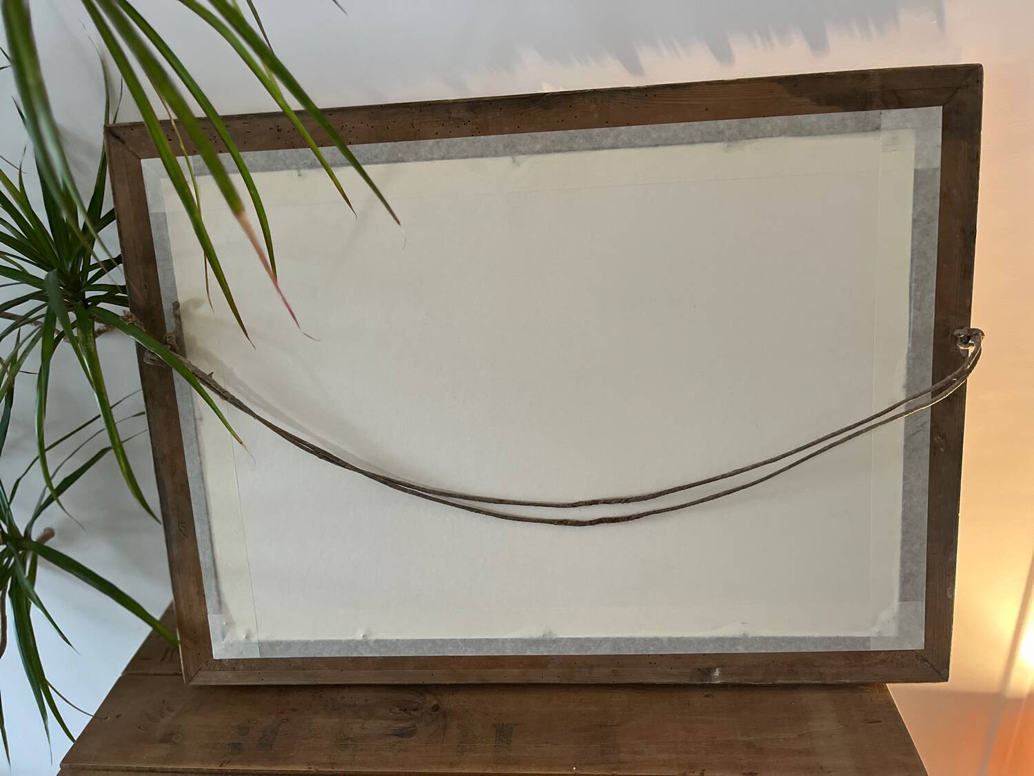 Antique mirror with a wooden and gilded stucco frame.