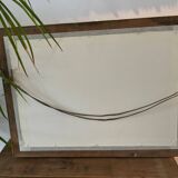 Antique mirror with a wooden and gilded stucco frame.