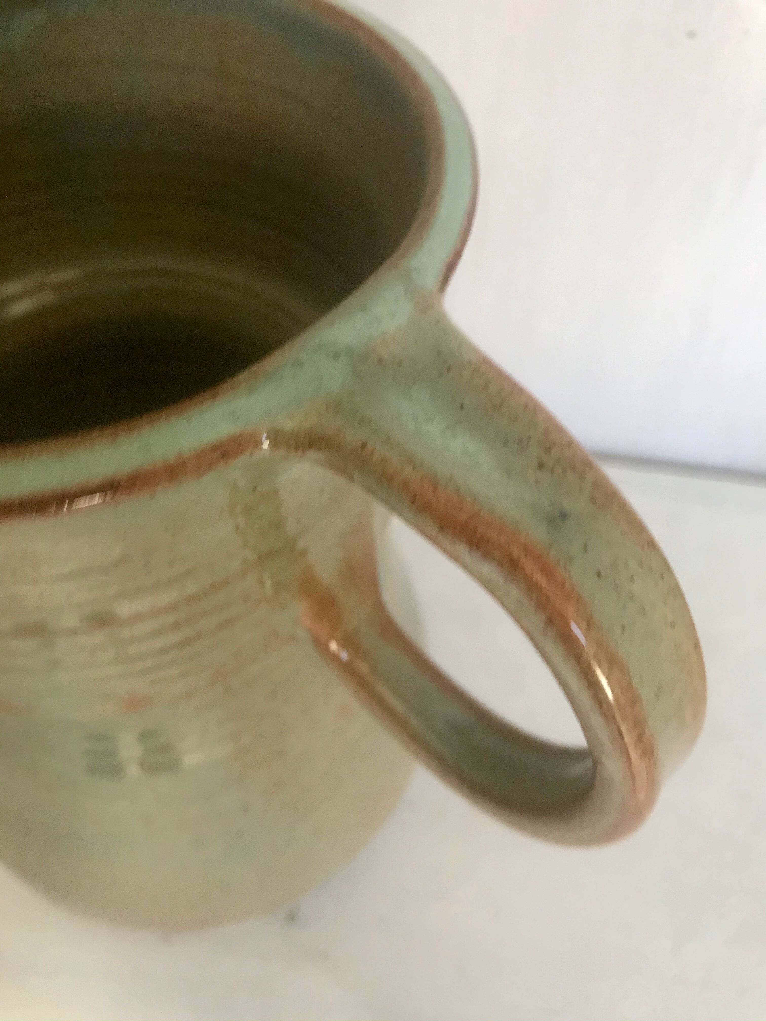 Pitcher and its vintage sandstone glasses