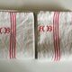 Paire de torchons en lin réserve de trousseau monogramme AB
