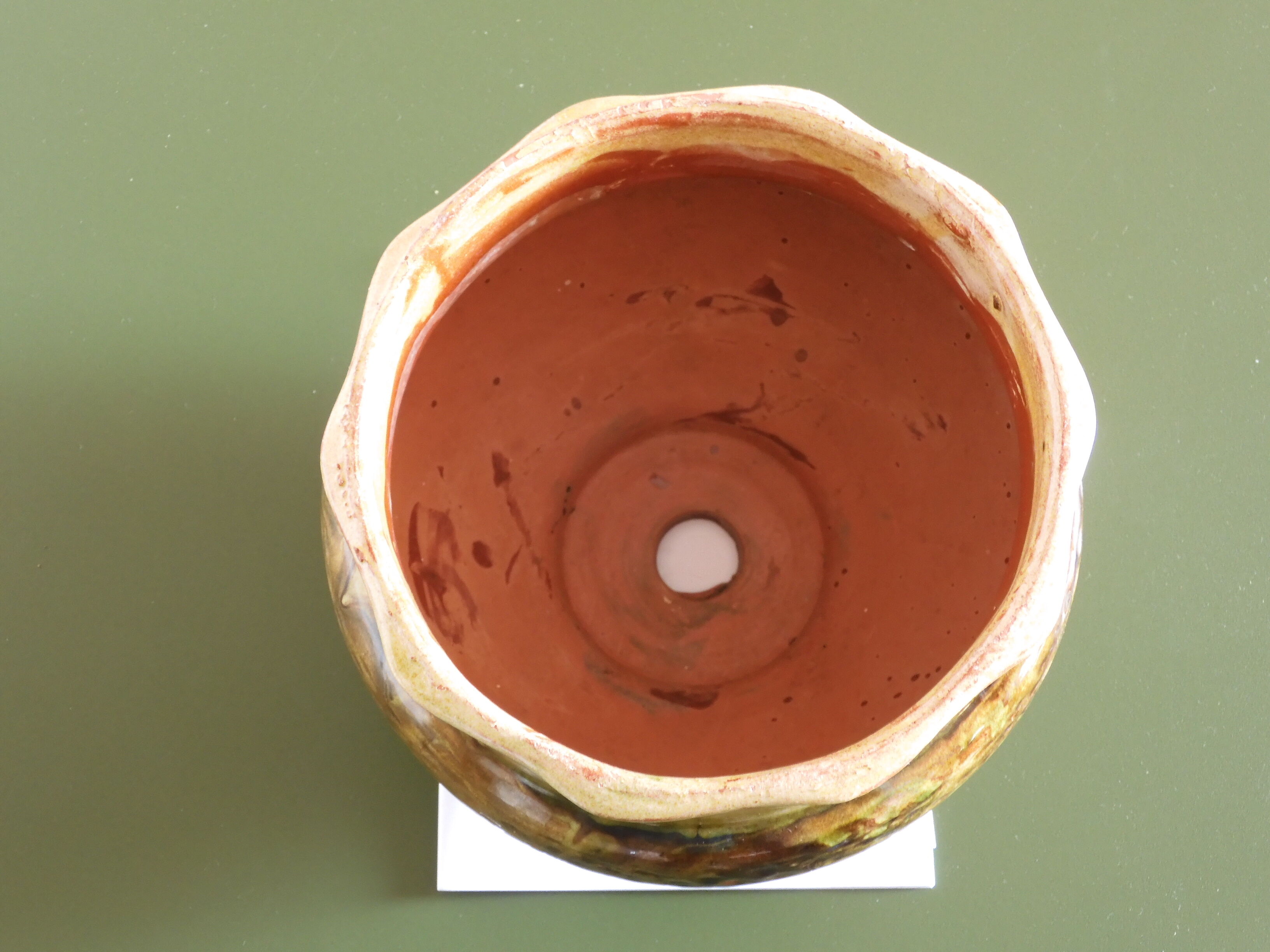 Provencal terracotta pot cover.