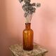 Amber glass bottle vase