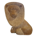 Sculpture of a lion in stone by Islay Grimes.