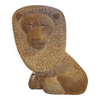 Sculpture of a lion in stone by Islay Grimes.