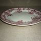 Beige earthenware plate with rose decoration and red garlands