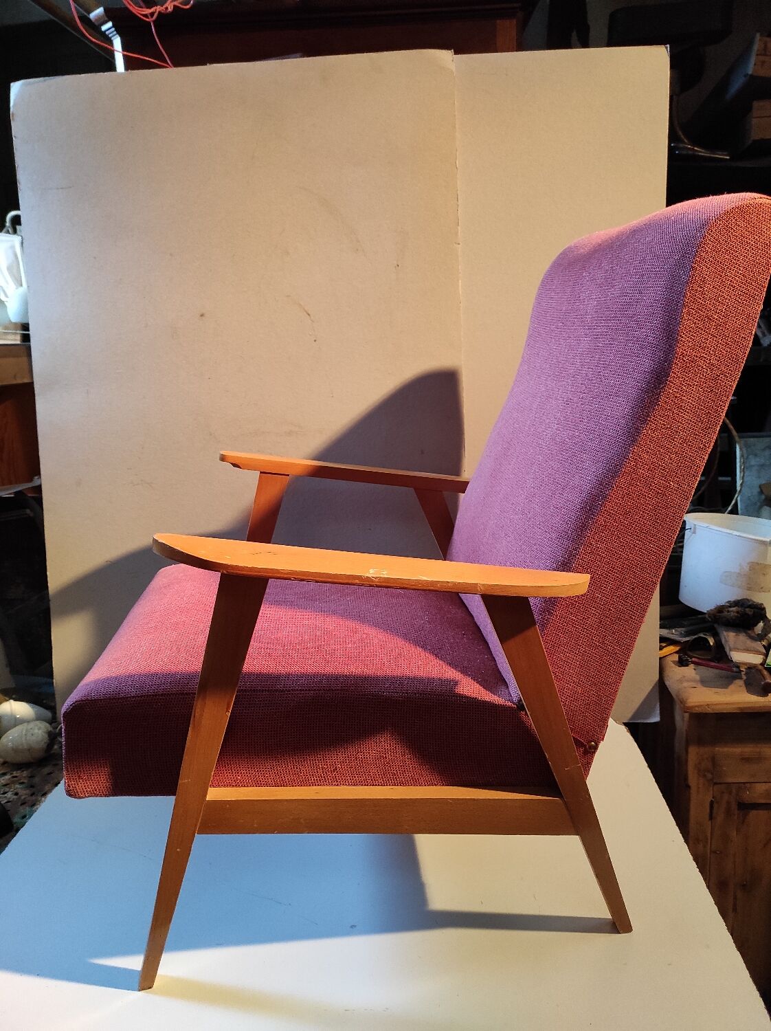 Vintage red armchair with compass feet in Scandinavian design