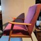 Vintage red armchair with compass feet in Scandinavian design