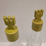 pair of decanters, bottles or jars, made in crystal with a ceramic tap enameled in green color