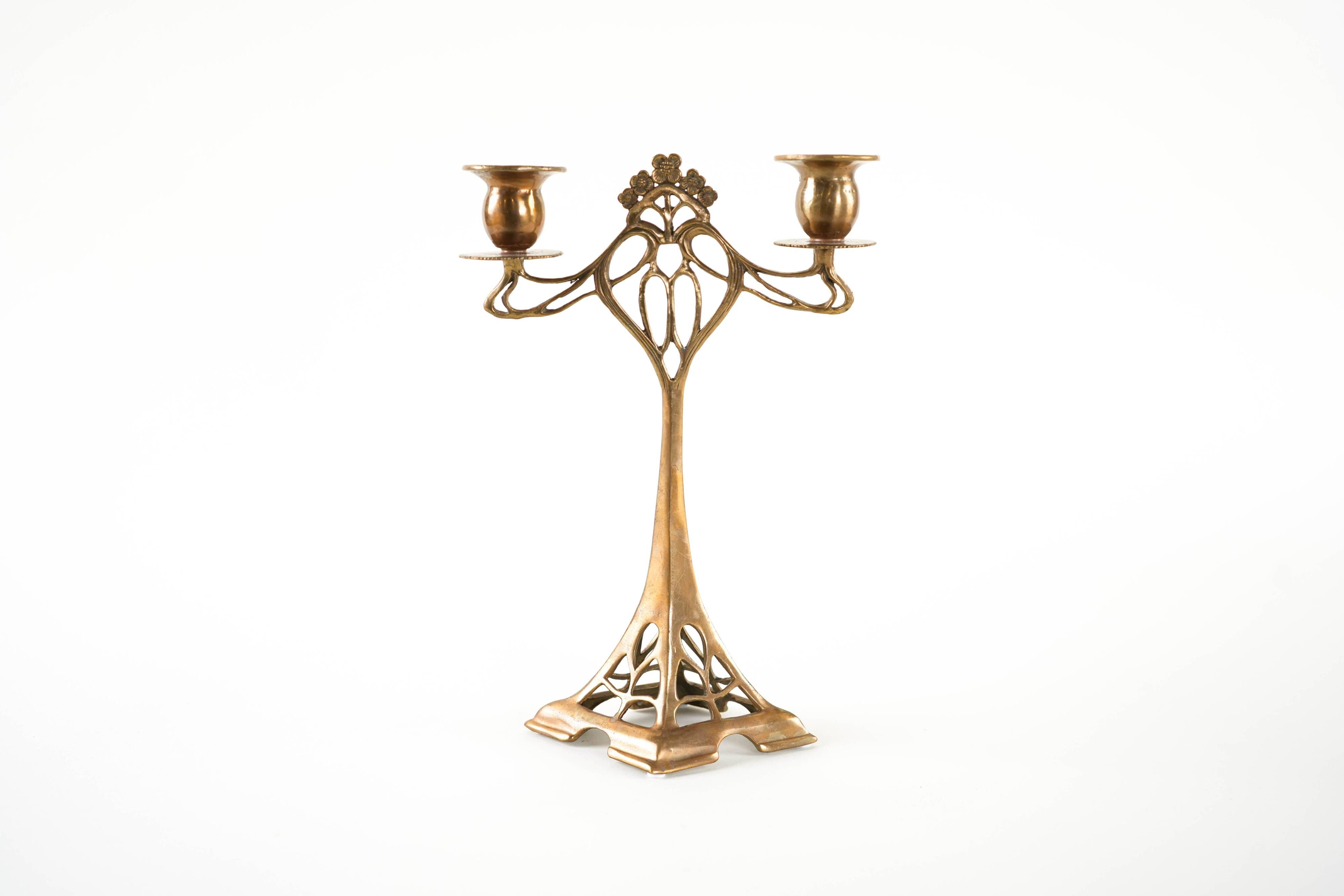 Art Nouveau brass candlestick with floral ornamentation, two arms, European