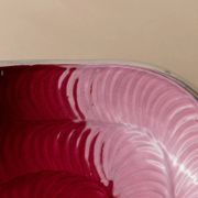 Red enameled steel bowl with textured interior and silver exterior; vintage Italian 1970s design