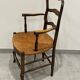 Provencal style straw armchair sometimes called marsh armchair