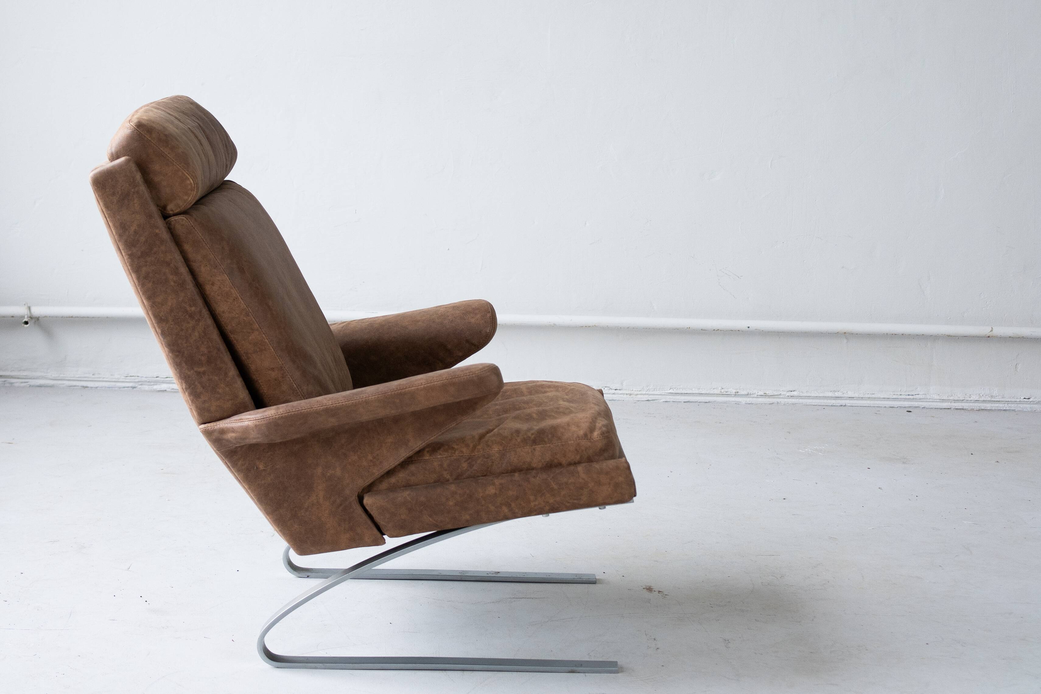 Vintage swing armchair and stool in leather by reinhold adolf for cor, 1970s, set of 2