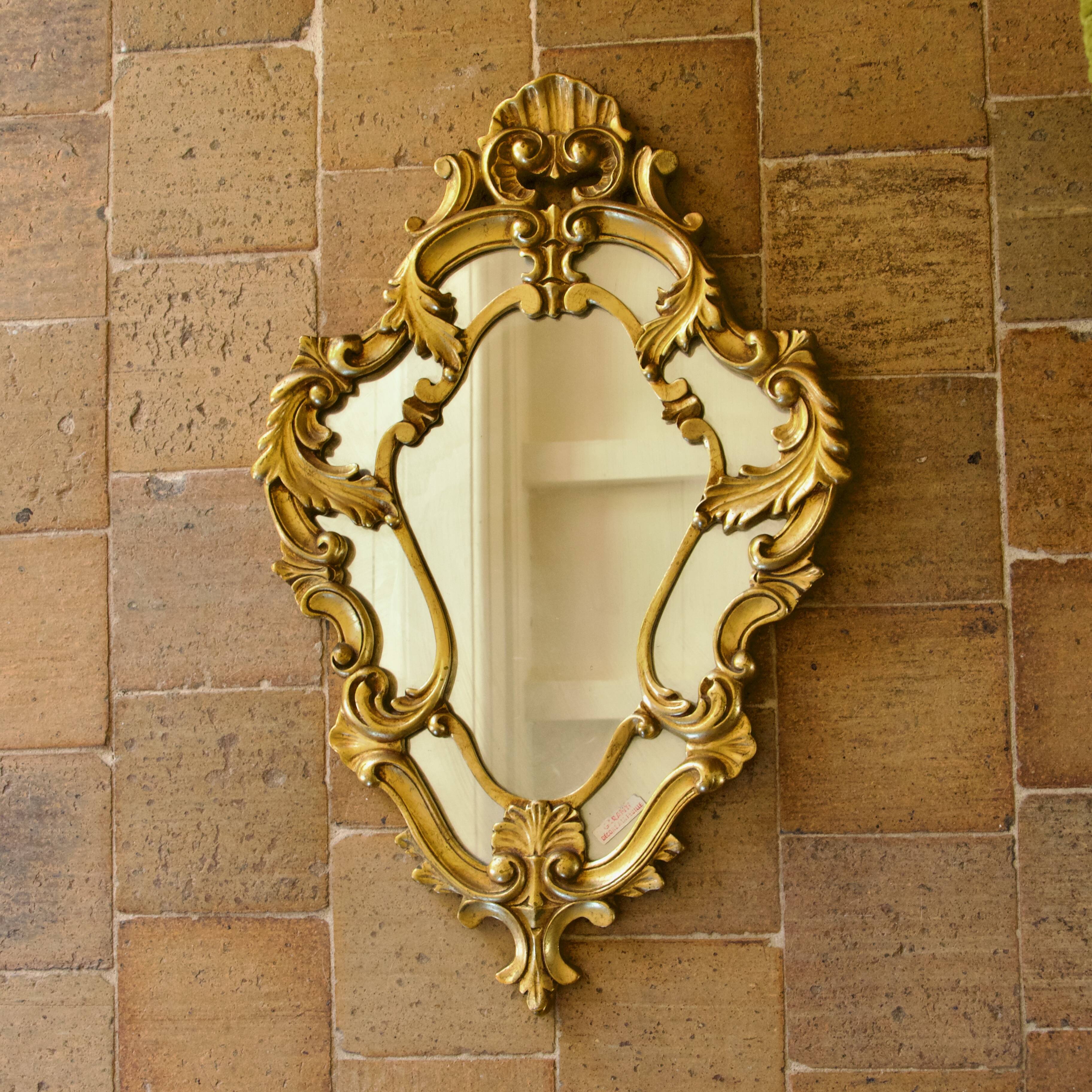 Antique Baroque mirror with gilded metal panels