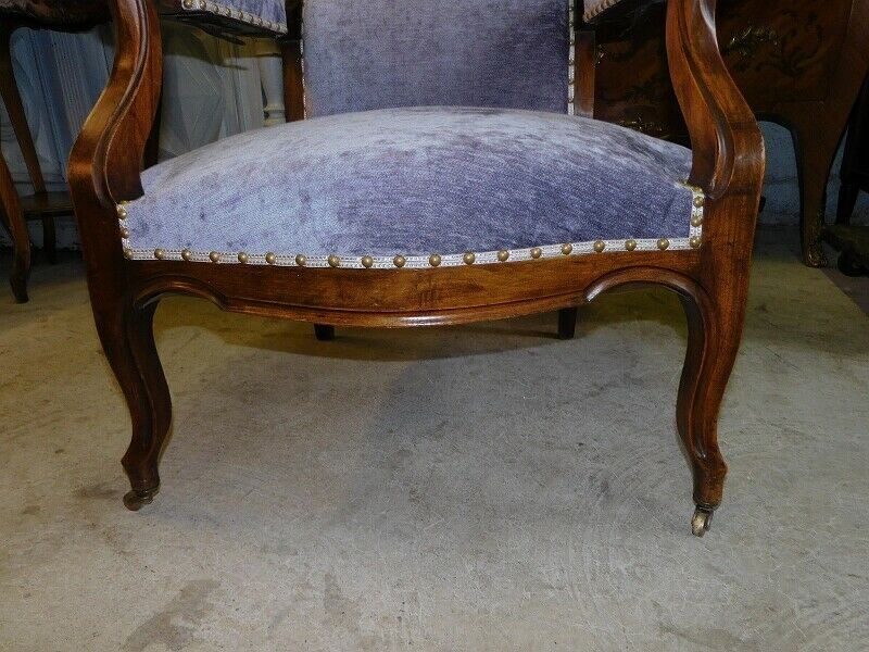 Relaxed Voltaire armchair with walnut racks
