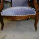 Relaxed Voltaire armchair with walnut racks