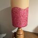 Vintage lamp with a carved wooden base from the 1970s.