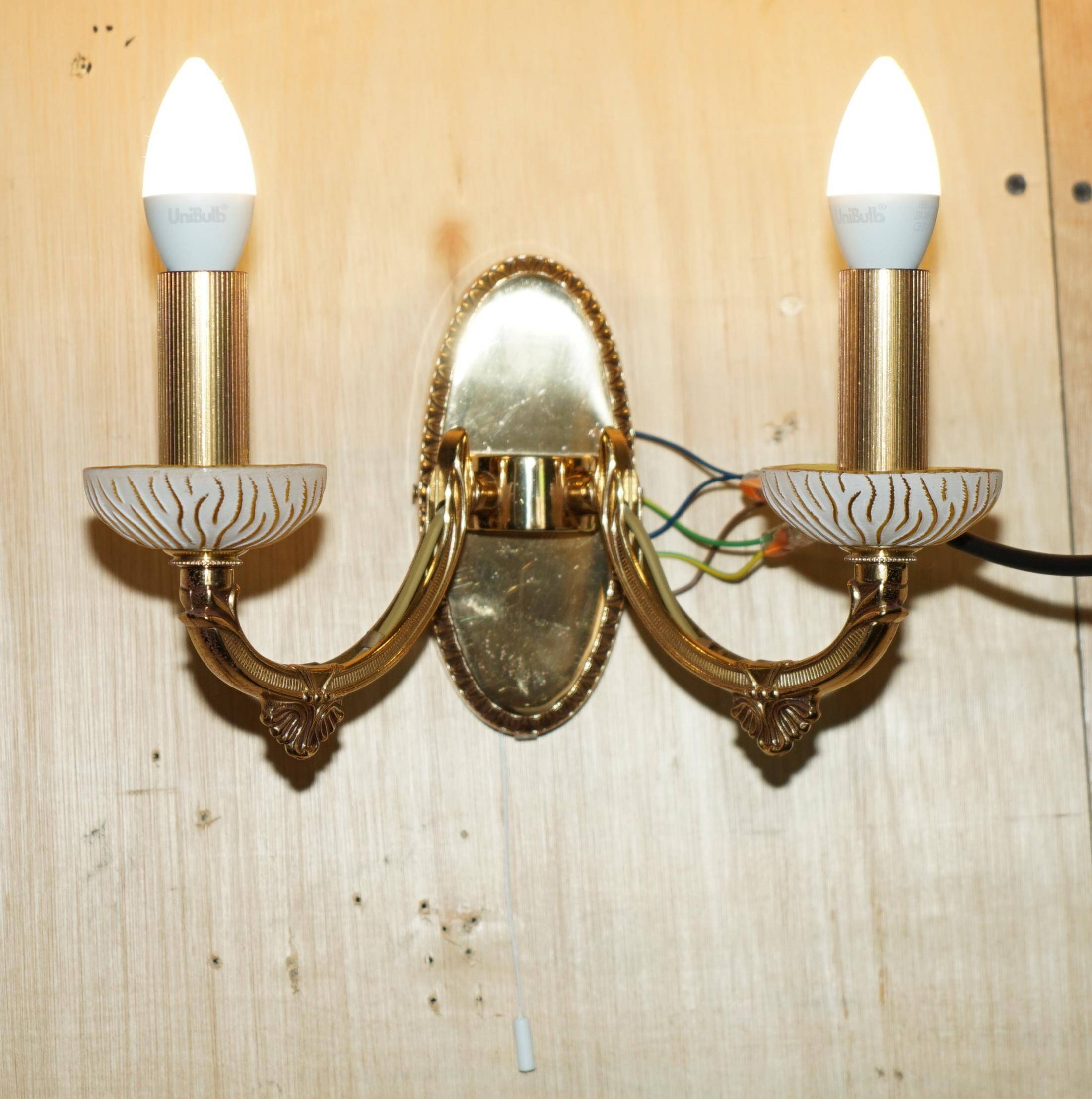 Reccagni wall light pair in brass and frosted glass.