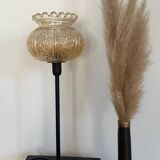 Table lamp with an antique crowned globe and a golden base