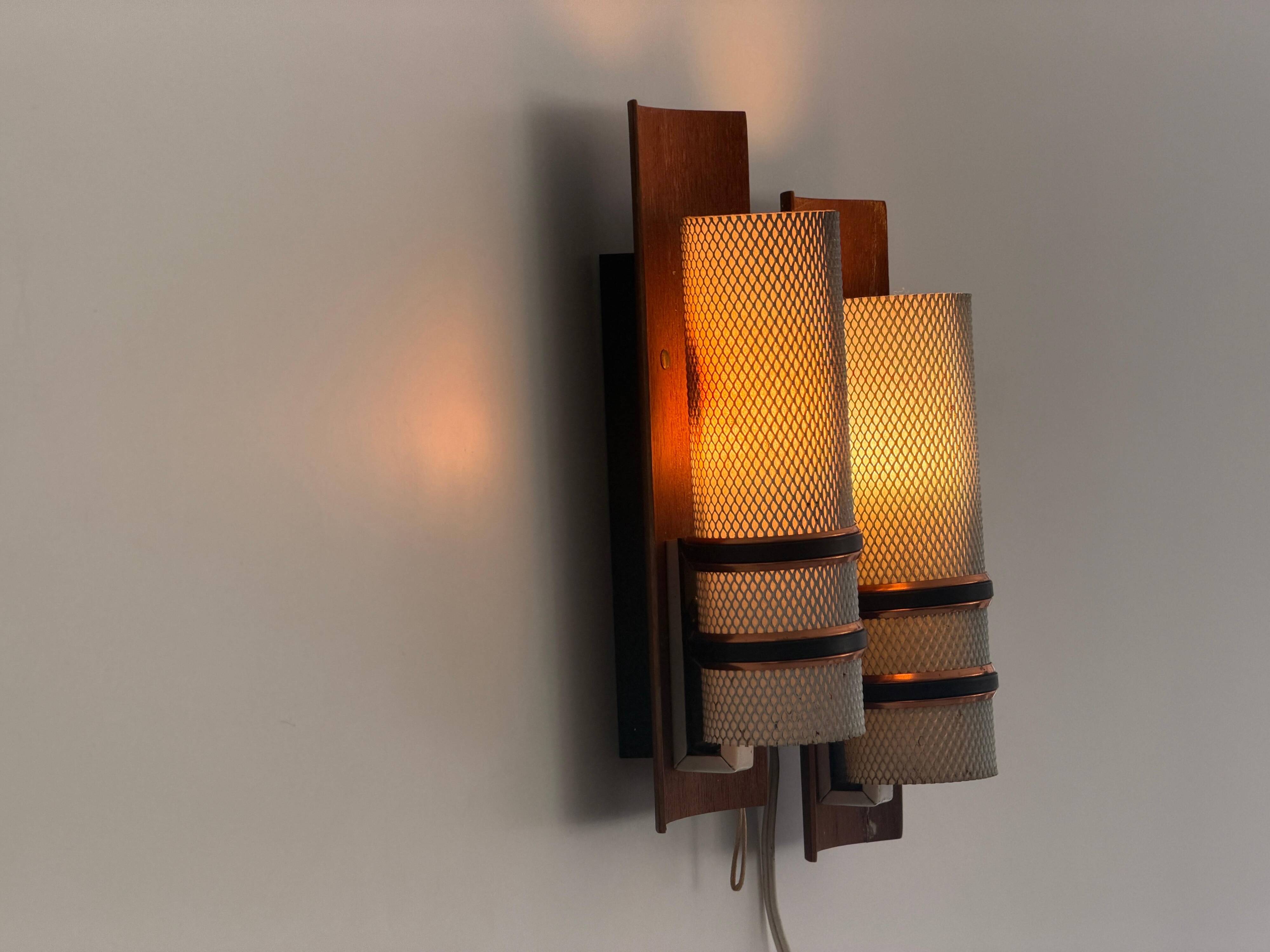 Simple mid-century wall light in metal, wooden and copper base, 1960s, Germany.