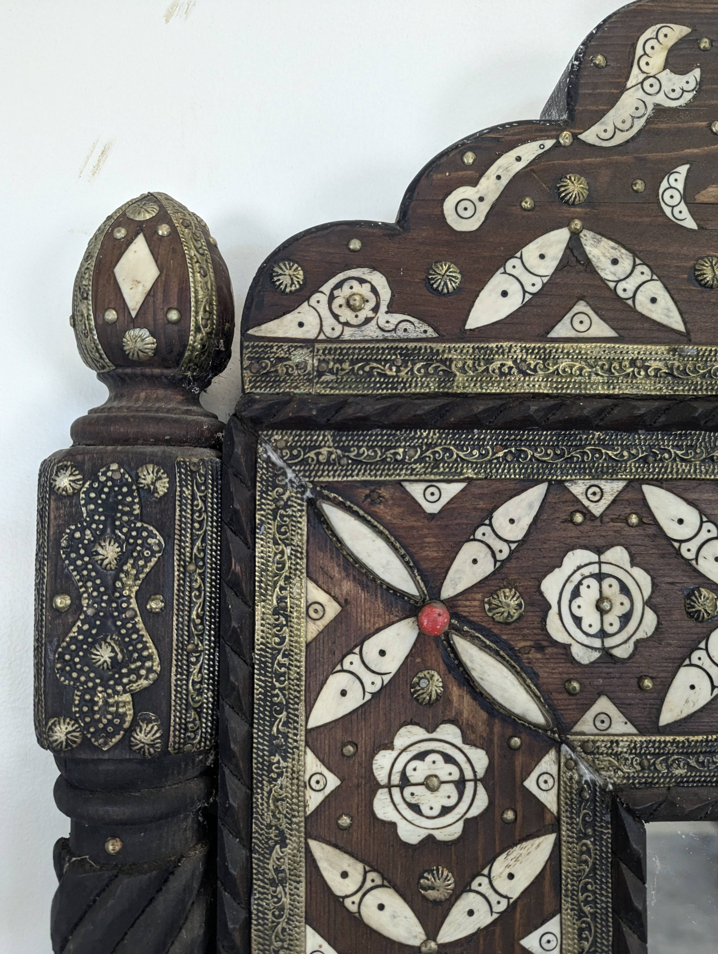 Orientalist mirror with bone inlays and hard stone cabochons.
