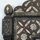 Orientalist mirror with bone inlays and hard stone cabochons.