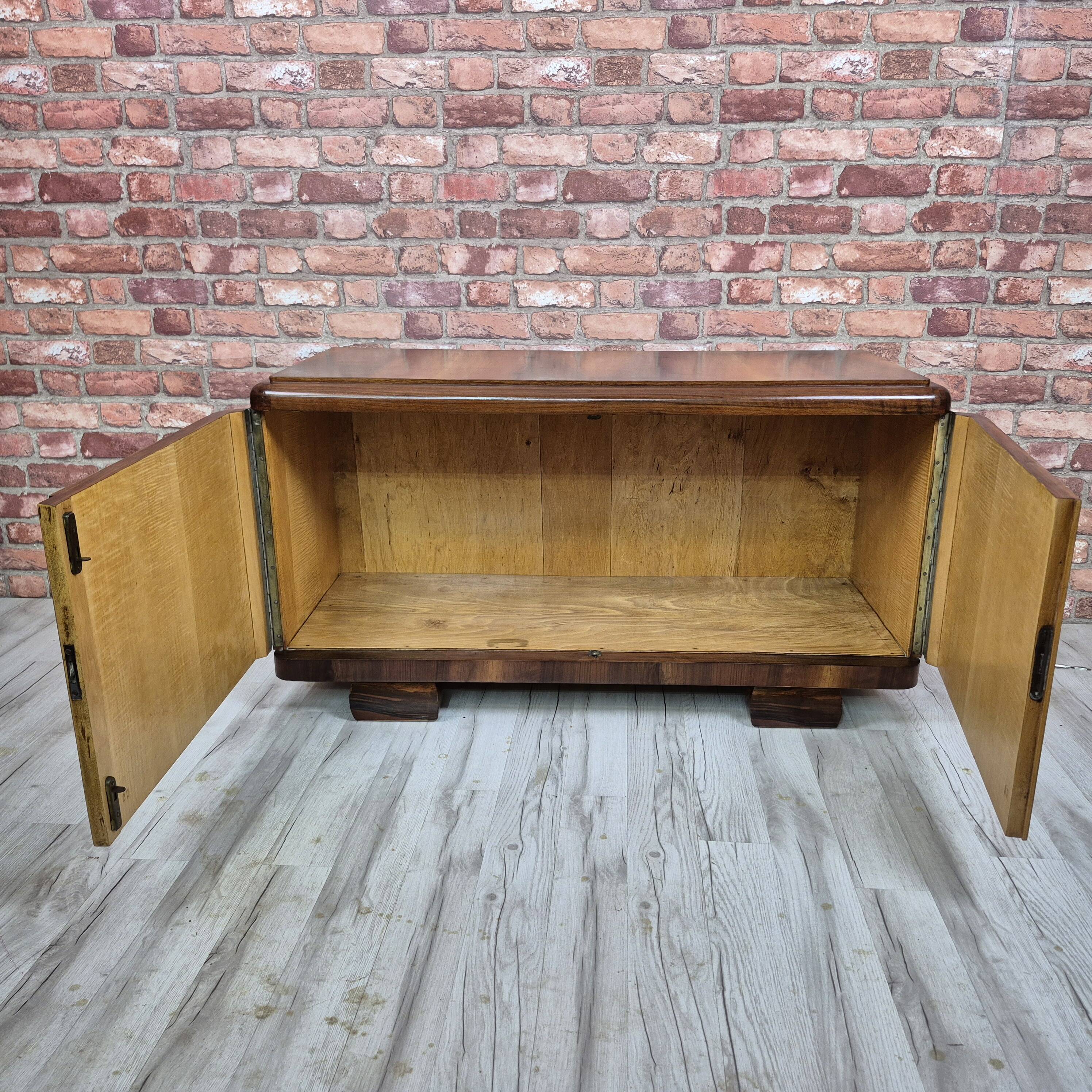 Low sideboard after renovation. Hypnotising veneer and Art Deco style.