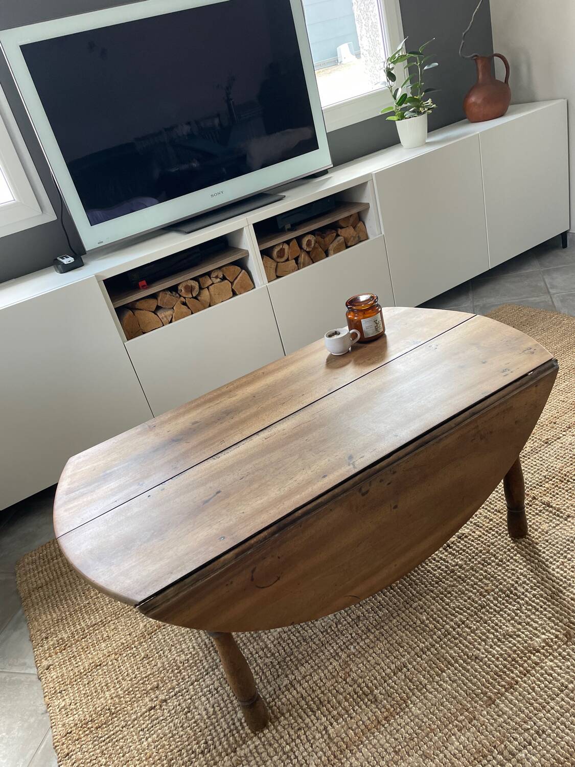 Round coffee table with hinged doors