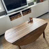Round coffee table with hinged doors