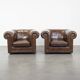 2 Chesterfield armchairs in dark brown cowhide
