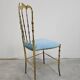 Mid-century Chiavari accent chair in solid brass with a plush seat.