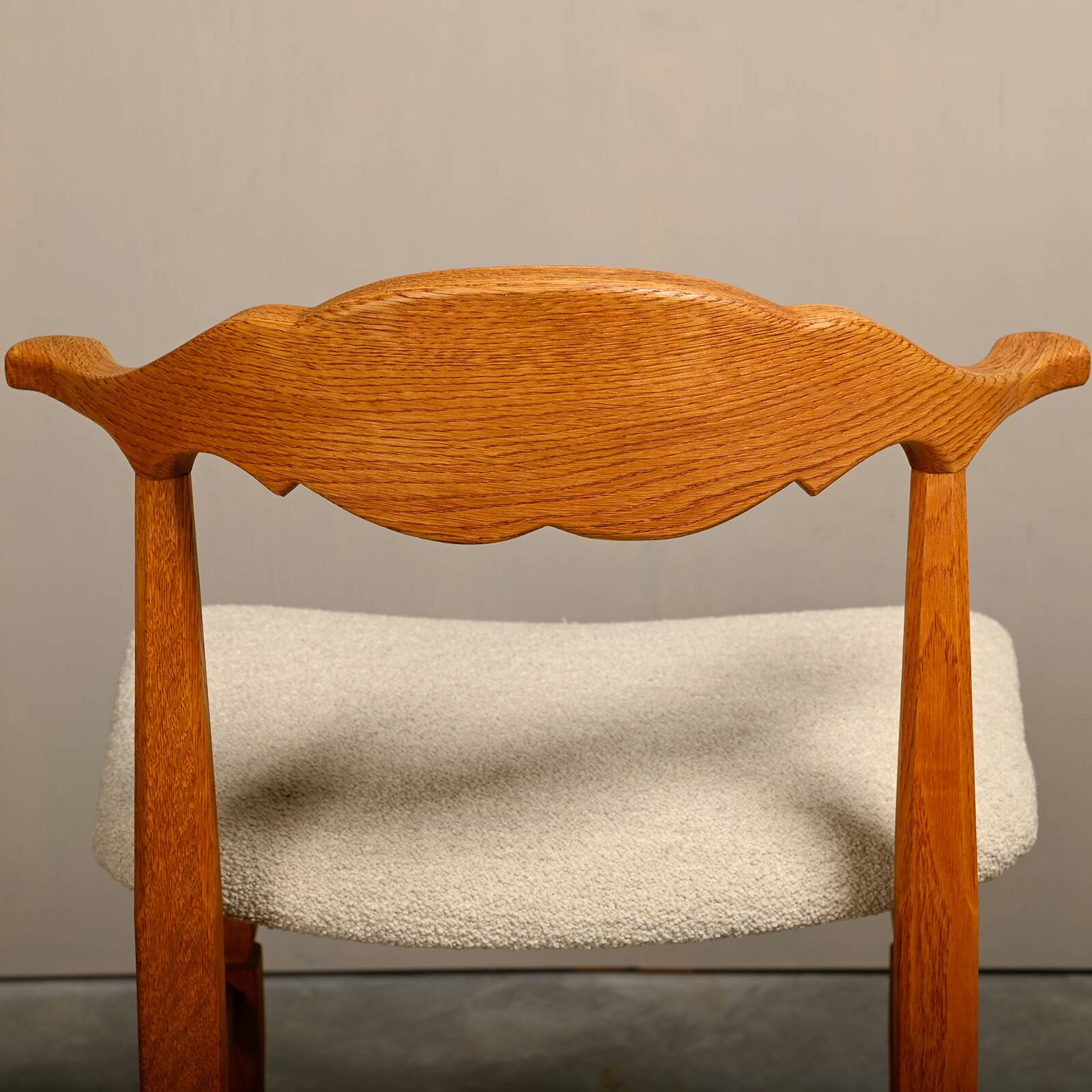 Henning Kjærnulf dining chairs set in Oak and Off White Bouclé, Denmark, 1960s