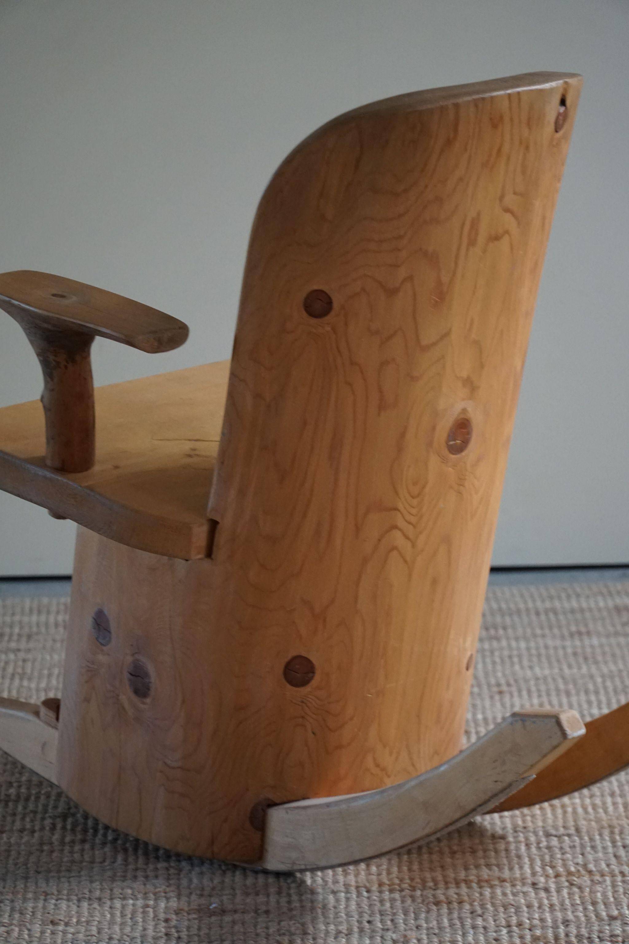 Unique sculptural rocking chair by the Finnish Matti Martikka in solid pine, 1960s.