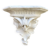 Antique wall console in patinated white plaster.