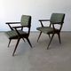 Pair of armchairs with a Scandinavian design in vintage teak from the 1960s.