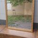 Miroir dore de style art-deco ( 1925-1945) avec  glace biseautee