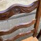 2 solid wood chairs with carved rush seats