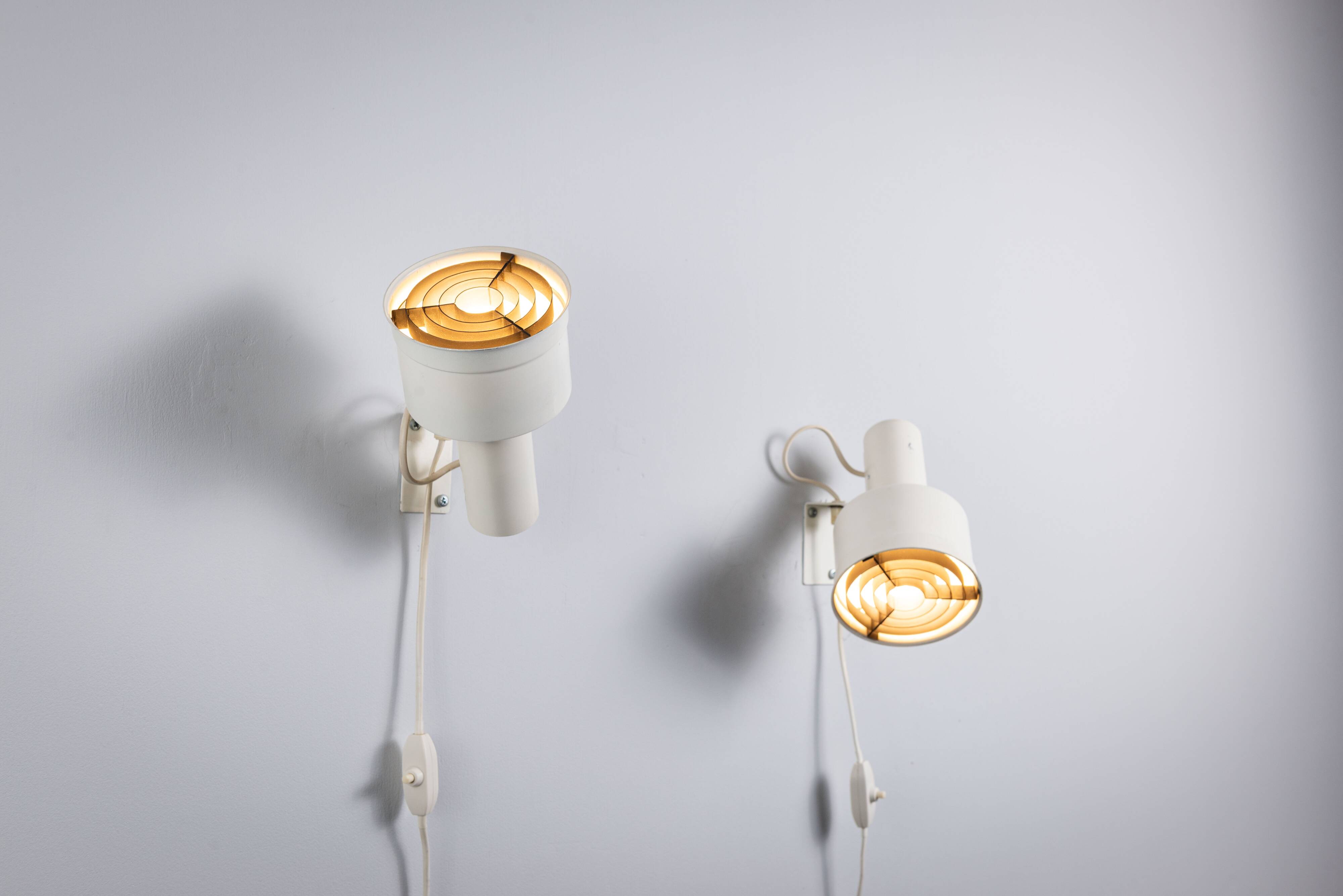 Pair of adjustable wall lamps designed by Per Sundstedt for Kosta Lampan