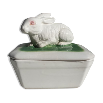 Pot terrine rabbit of Bavent in white earthenware on square of greenery