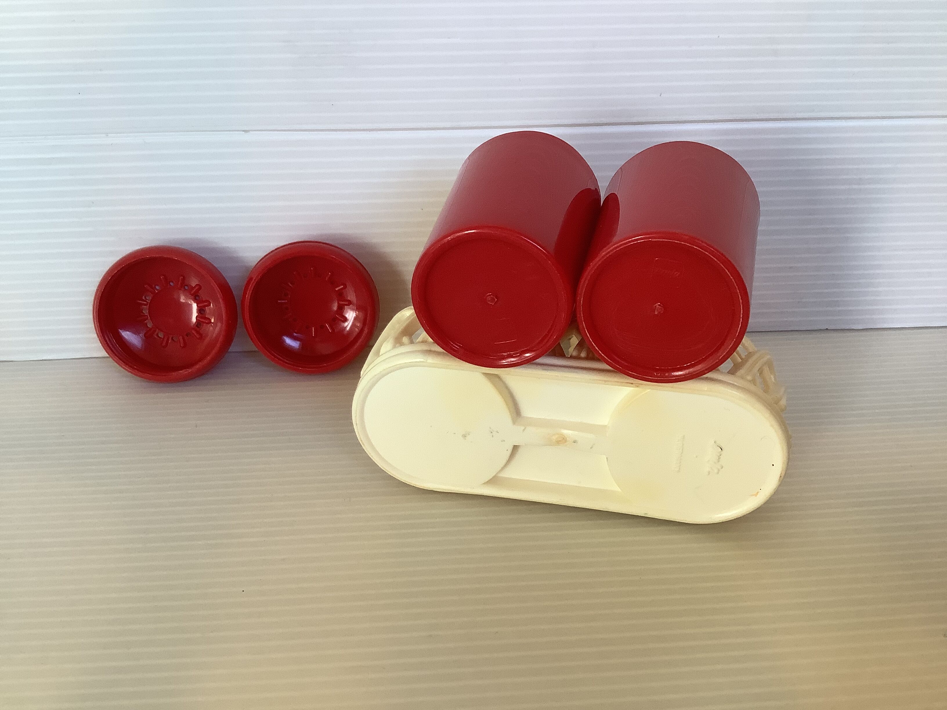 Red and white plastic salt and pepper shakers Emsa.
