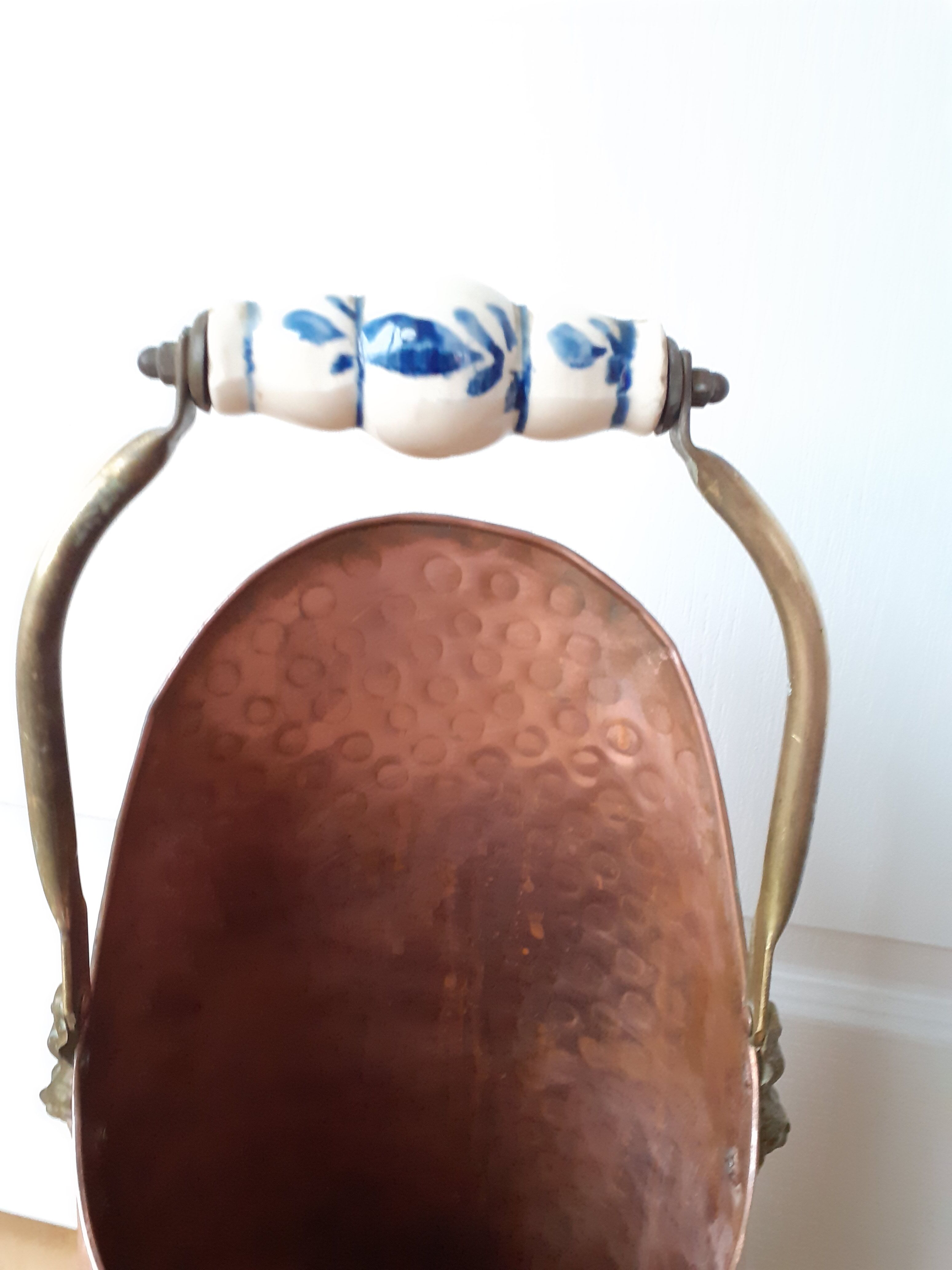Old coal bucket made of copper and brass