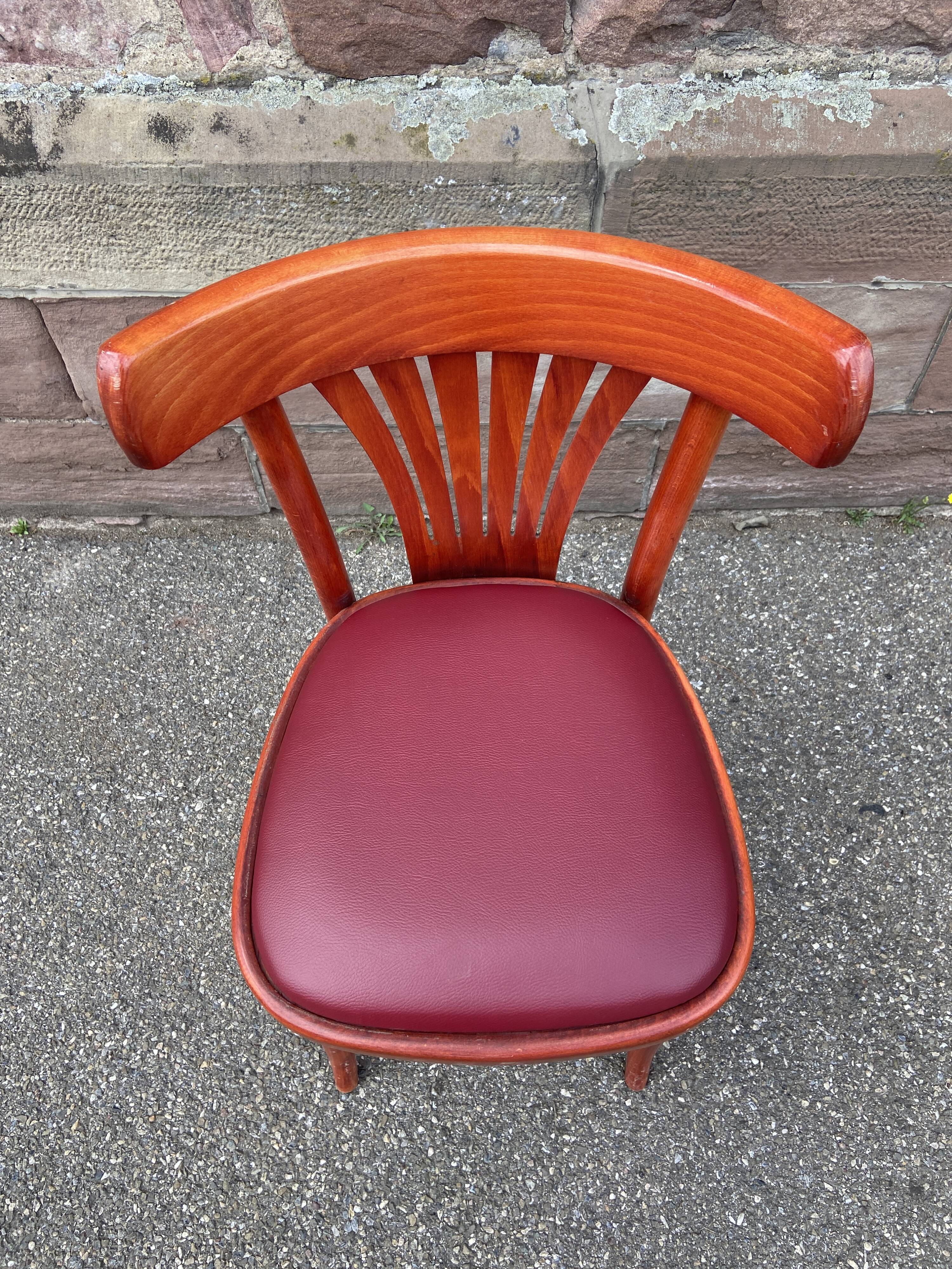 Pair of Alsatian bistro chairs in wood and leather, 1960
